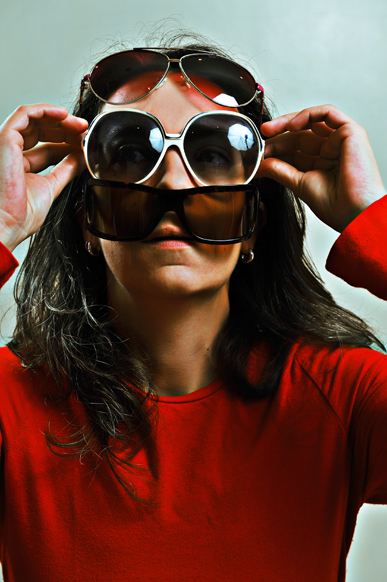 Emanuela Franchini  conceptual self portrait with plenty of sun glasses