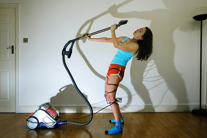 emanuela franchini photography, Vacuum Attack, conceptual self portrait photography at home with electrical appliances, objects and accessories in the household and living environment